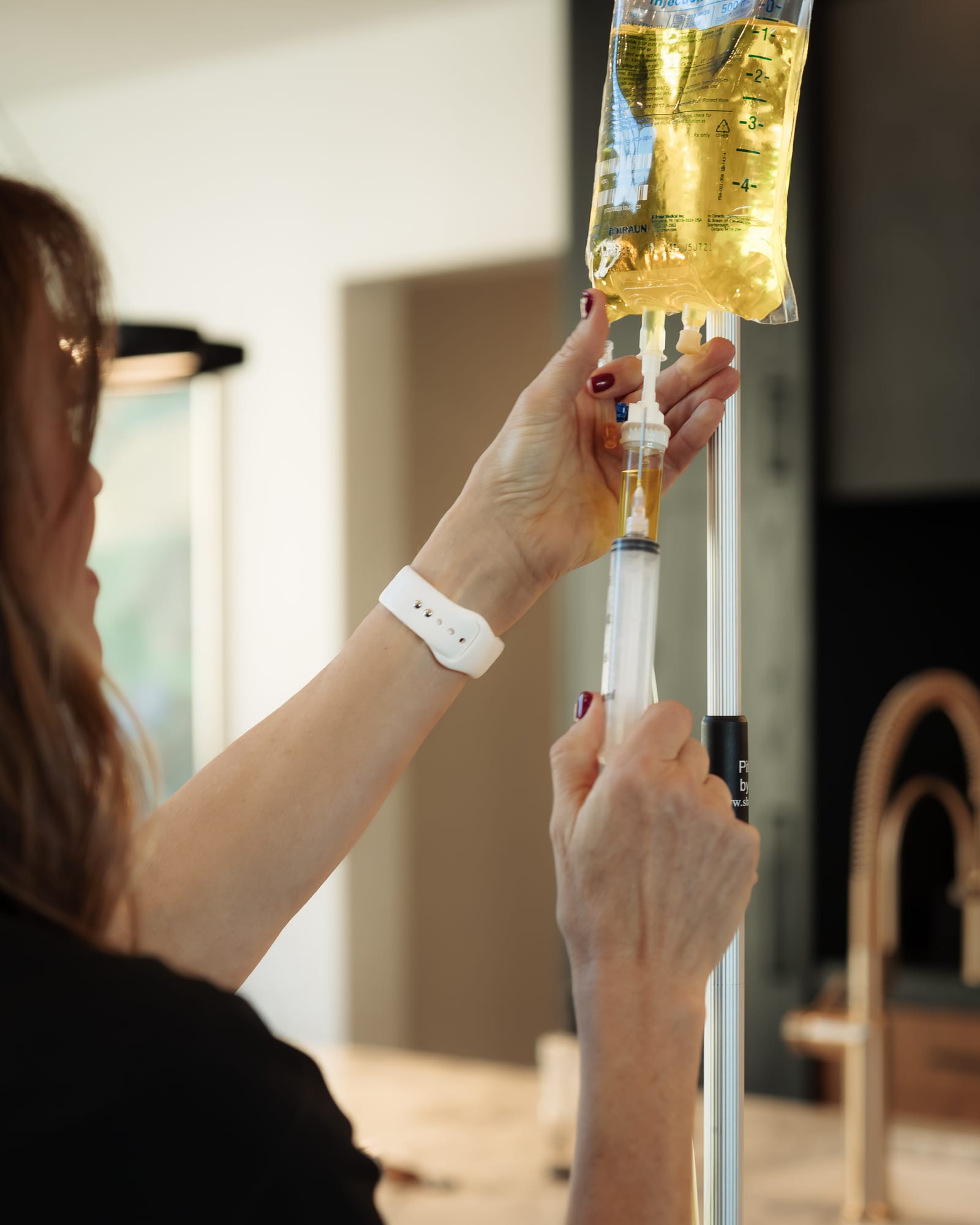 Preparing an IV infusion with a fluid bag and drip chamber